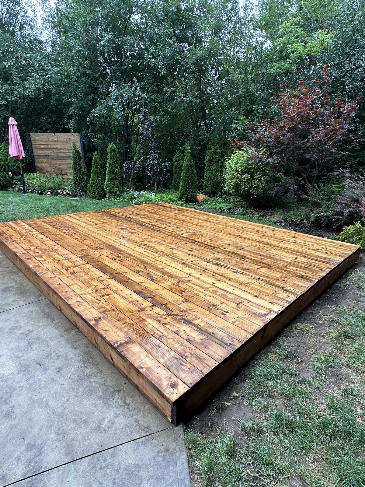 Low-profile backyard deck by Pearl Improvements