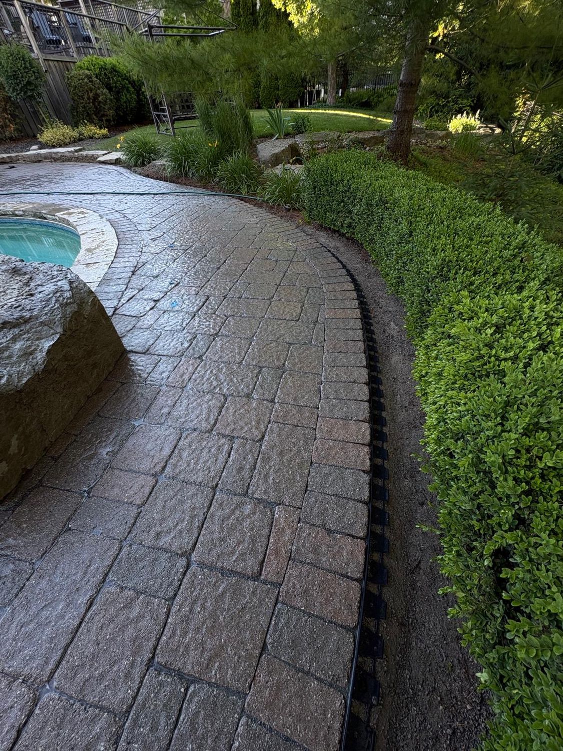 Pool-side interlock re-laid level with a fresh border edge